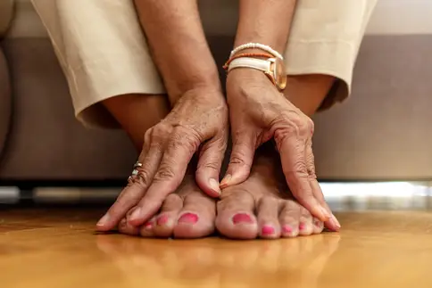 photo of senior woman with foot pain