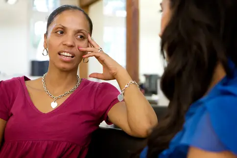photo of mature woman talking with friend