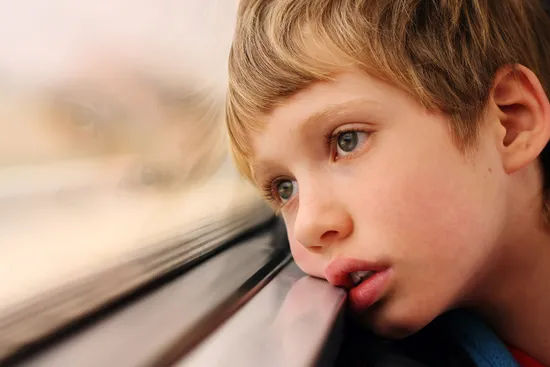 child looking out window