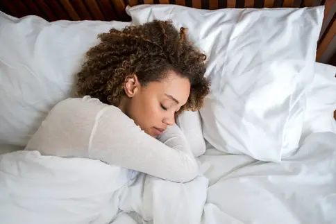 photo of woman asleep in bed