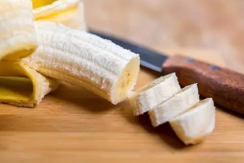 photo of sliced banana on cutting board