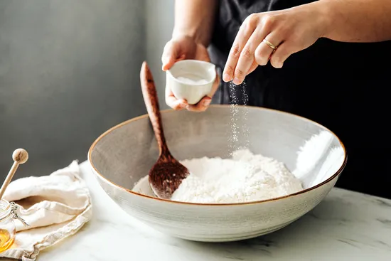 photo of sprinkling salt into flour