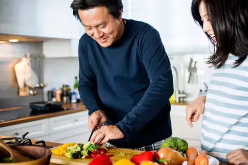 photo of couple preparing healthy meal