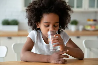 Kids can easily get dehydrated when they're sick or playing outside in the heat. (Photo credit: Fizkes/Dreamstime)
