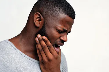 Severe pain in your jaw could be a sign of TMJ disorder. Home treatments can help ease your symptoms. (Photo credit: Prostockstudio/Dreamstime)