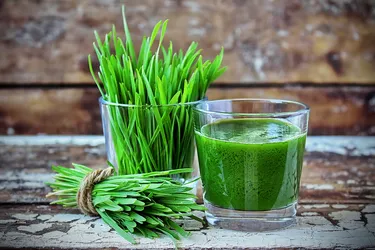 Many people drink a 1-2 oz shot of wheatgrass on its own or add it to their favorite smoothie recipe or juice. (Photo credit: Elena Moskalenko/Dreamstime)