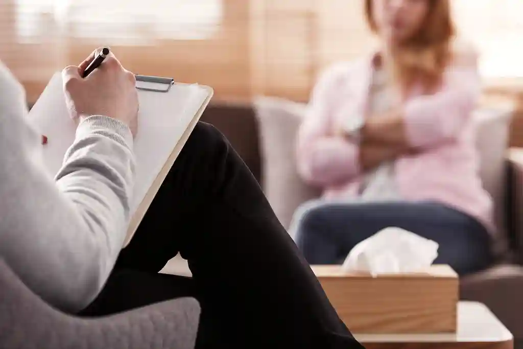 photo of therapist taking notes in session