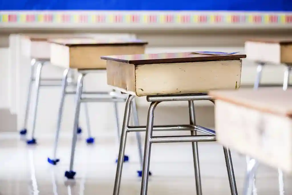 photo of empty classroom desks