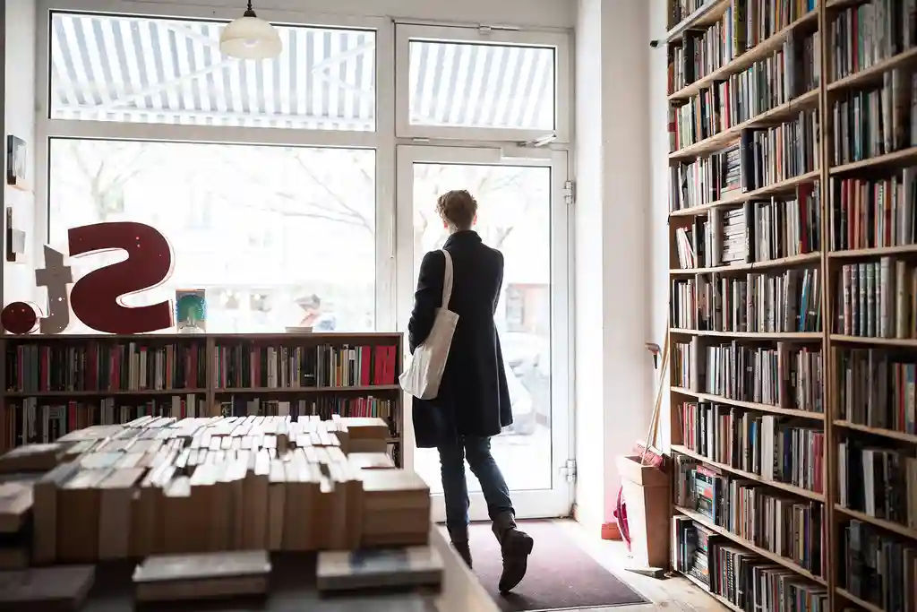 photo of woman leaving bookstore