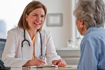 photo of senior woman talking with doctor