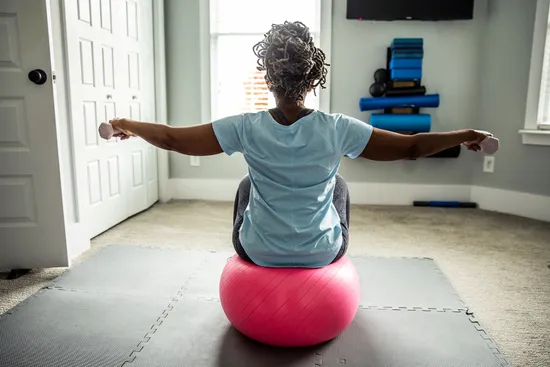 photo of senior woman exercising in home gym