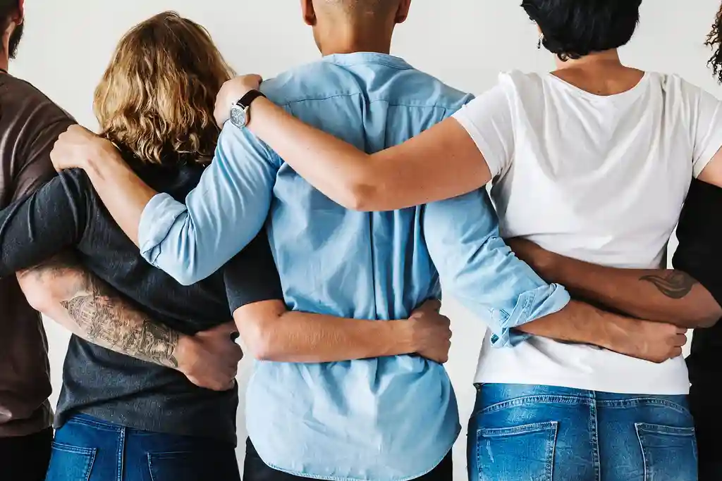 photo of friends holding each other