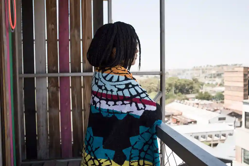 photo of woman on balcony