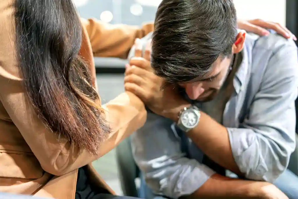 photo of wife consoling husband