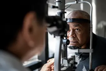 photo of ophthalmologist examining patients eyes