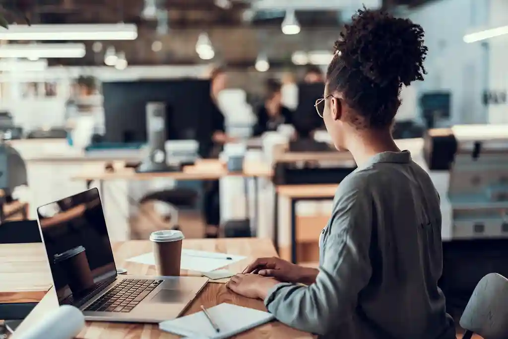 photo of young woman working in office