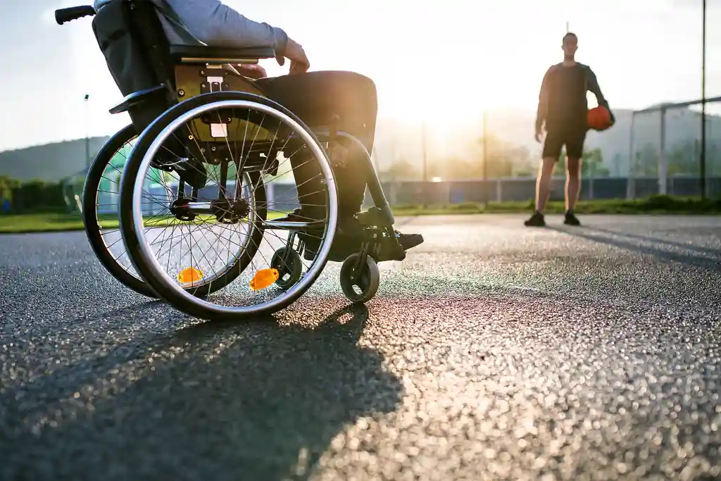 photo of teenager in wheelchair basketball court