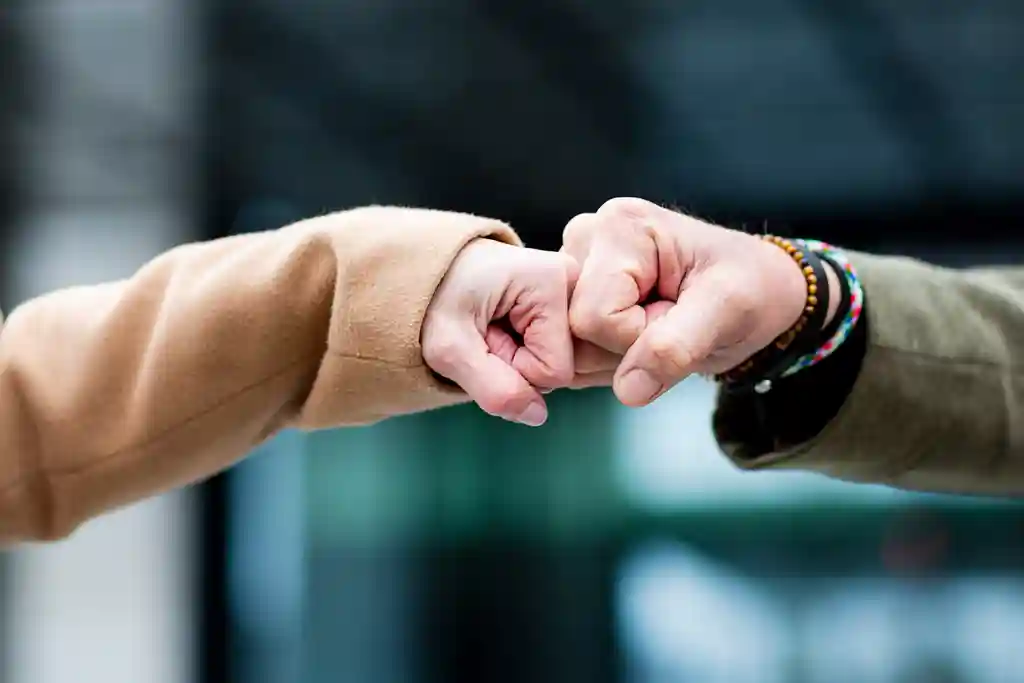 photo of senior fist bump