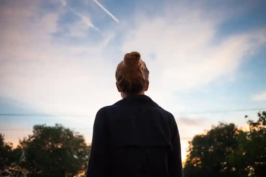 woman silhouette looking at sky