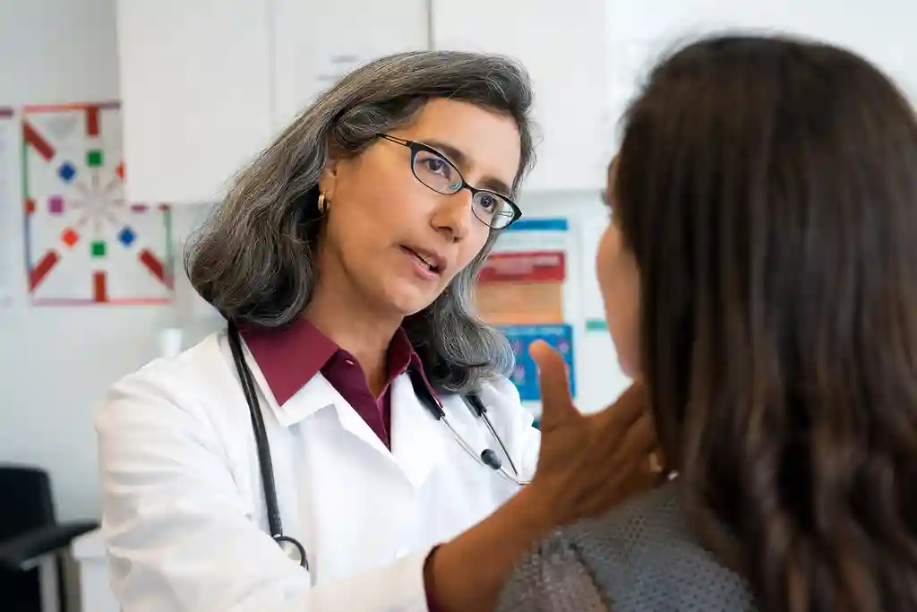 photo of doctor checking patient's lymph nodes