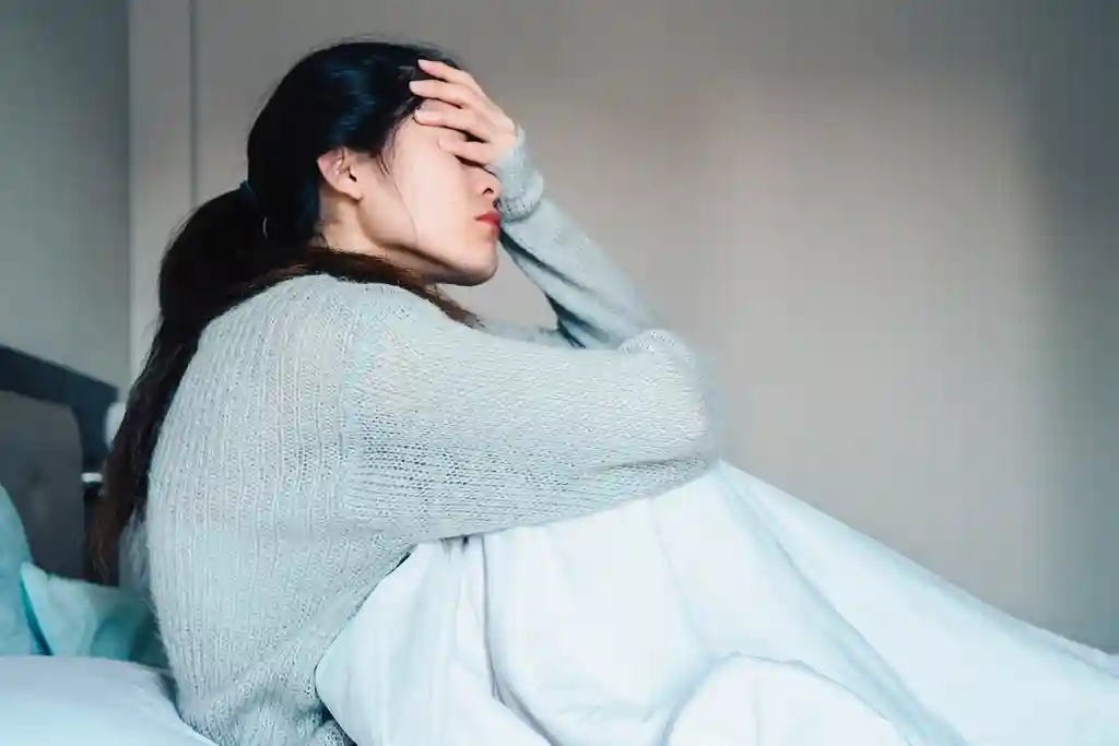 photo of unhappy woman in bed