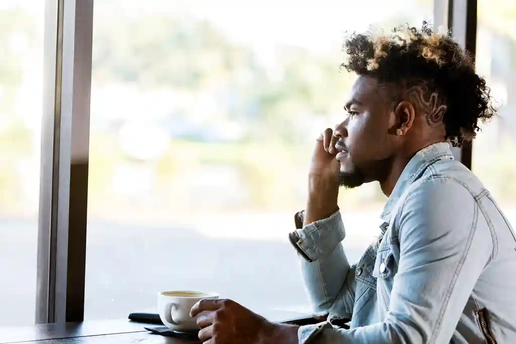 photo of man looking out window