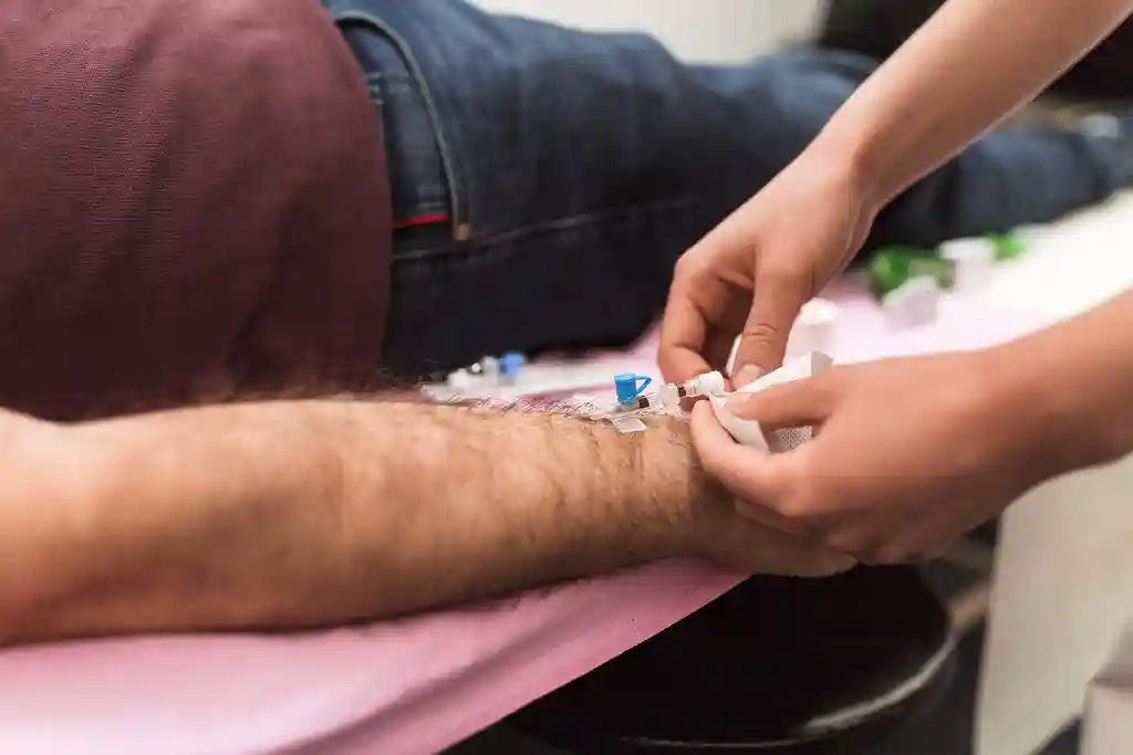 photo of man receiving iv drip