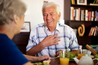 photo of senior couple eating meal