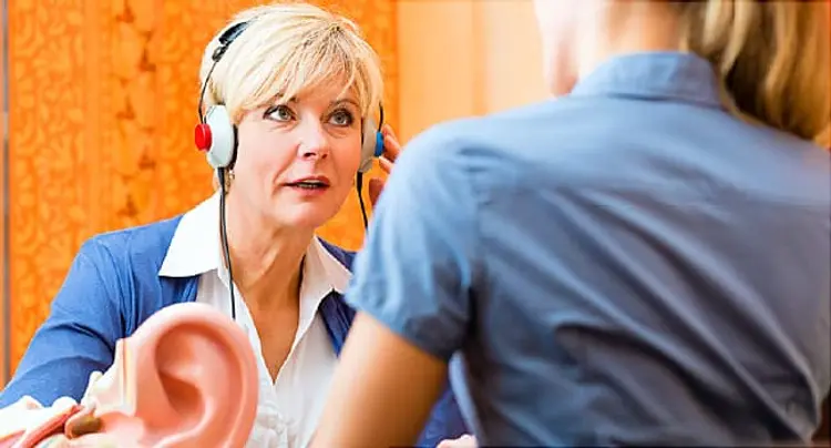 woman taking hearing test