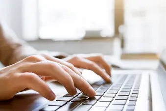 characterize of particular person typing on keyboard