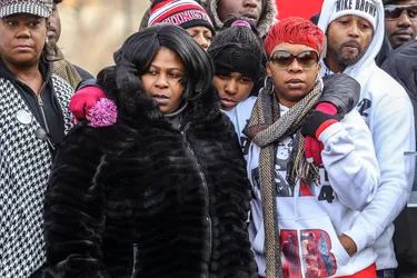 Samaria Rice, front left, stands with Lesley McSpadden, mother of Michael Brown, front right.
