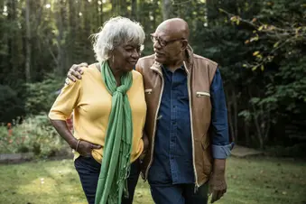 photo of senior couple walking outside