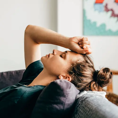 photo of woman with anxiety on couch