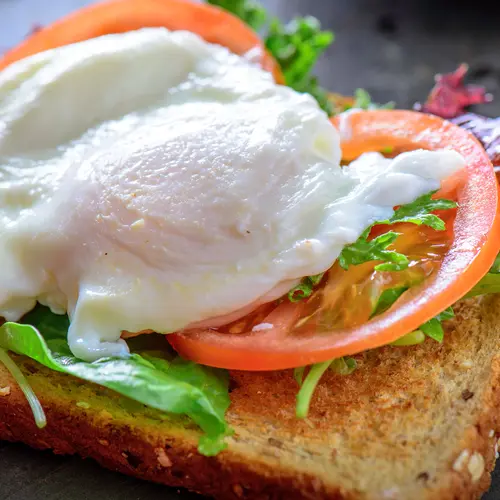 photo of poached egg on toast