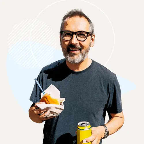 photo of man smiling with food