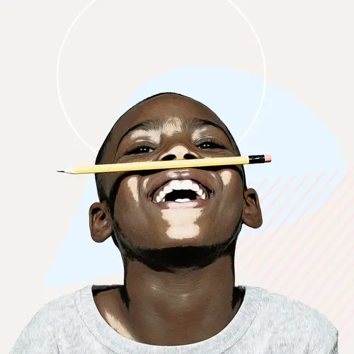 photo of little boy with pencil on nose smiling
