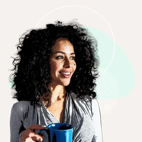 photo of woman smiling holding coffee cup