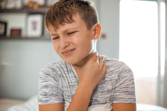 photo of Young boy with a sore throat