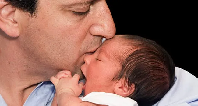 photo of dad with newborn