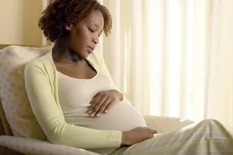 photo of pensive pregnant woman