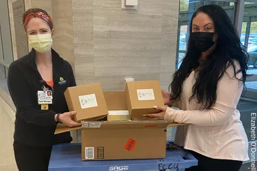 O'Donnell helps deliver a support box to a hospital. 