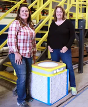 Professor Kimberly Prather (right) with her assistant Monica Castrejon, who built her first C-R air filtration box in only 20 minutes. Photo by Chelsea Zhao. 