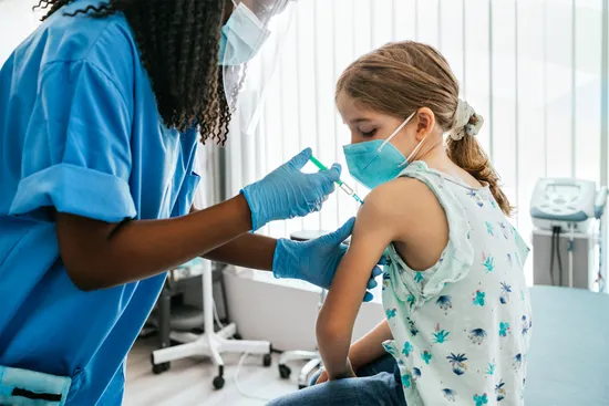 photo of young girl receiving vaccination