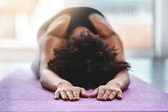 photo of fitness black woman yoga stretch