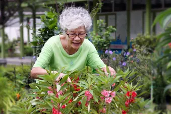photo of mature woman gardening