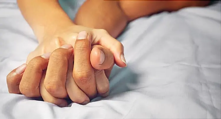 passionate hands on bed