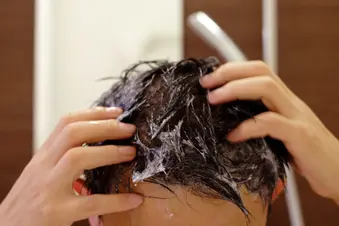 photo of man washing hair