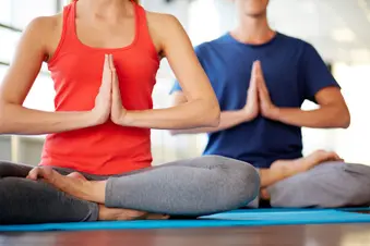 woman and man in yoga class