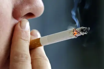 photo of woman smoking cigarette