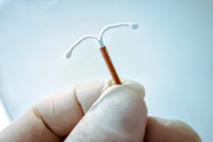 The IUD prevents pregnancy by stopping sperm from reaching and fertilizing eggs. Photo Credit: Lalocracio / Getty Images